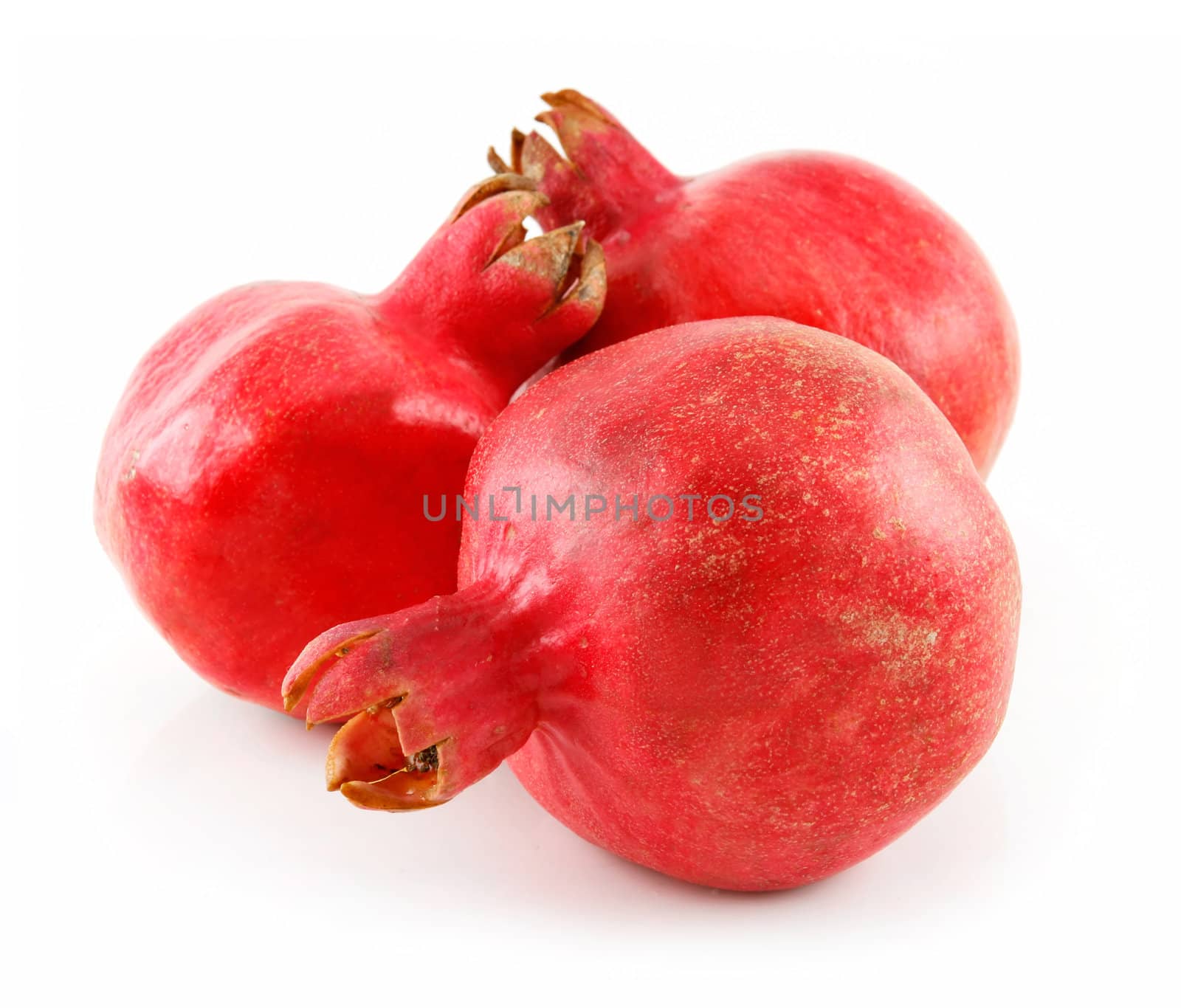 Three Ripe Pomegranates Fruits Isolated on White Background