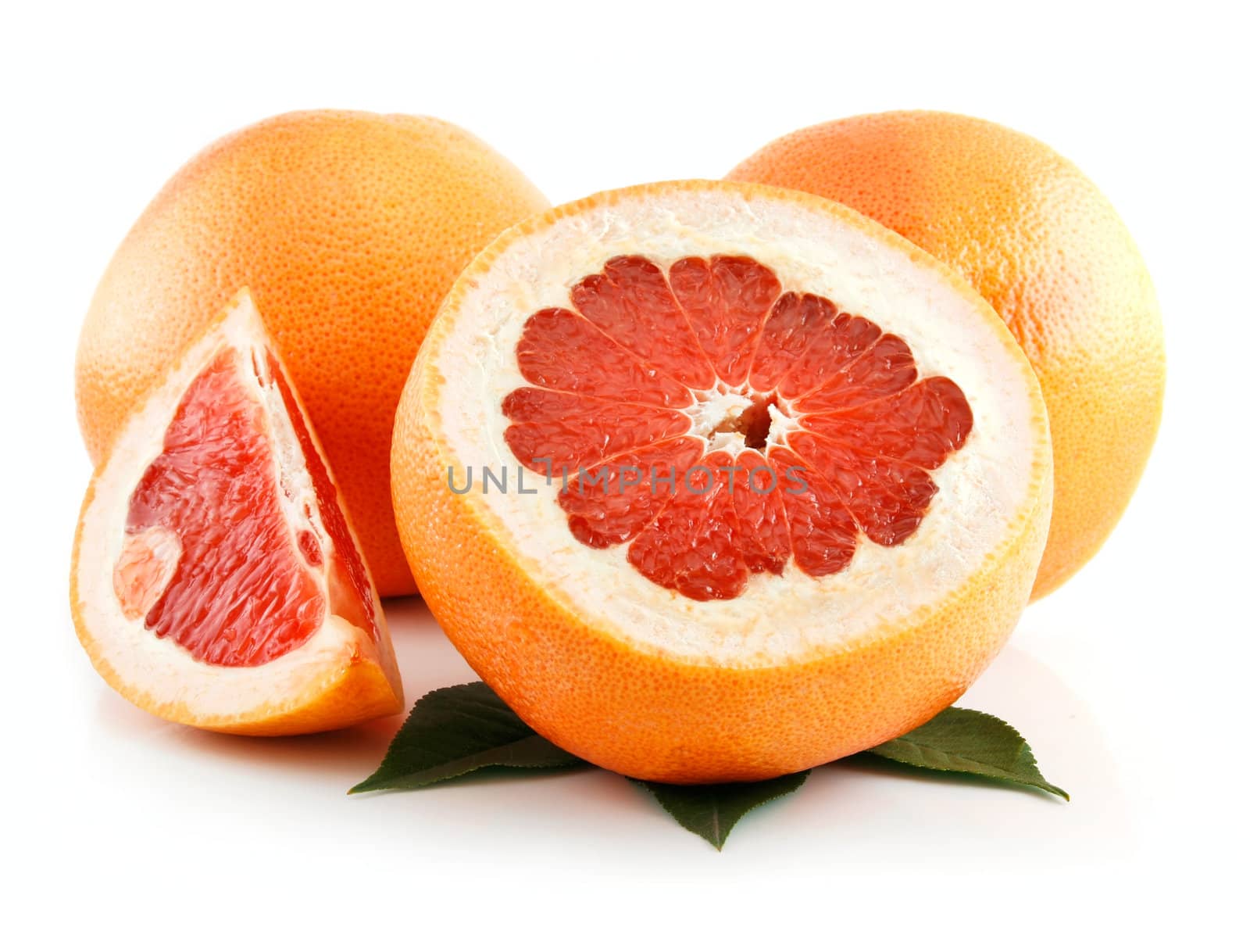 Ripe Sliced Grapefruit with Leaves Isolated on White Background