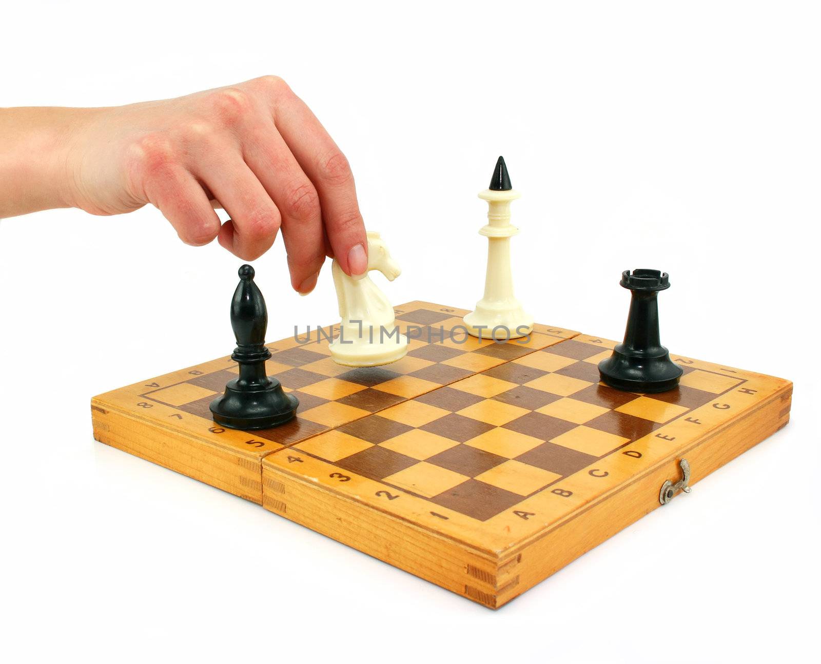 Chessboard and female hand gives check isolated on a white background