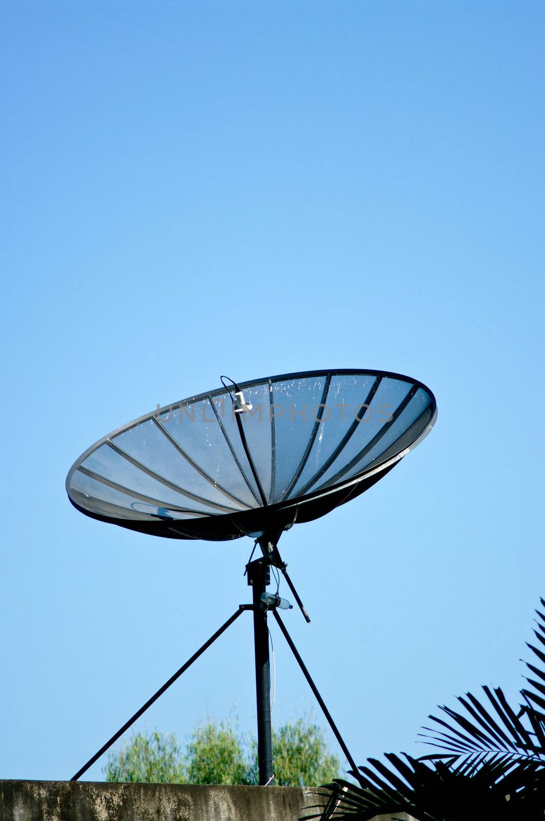 Dish aerial on top of building