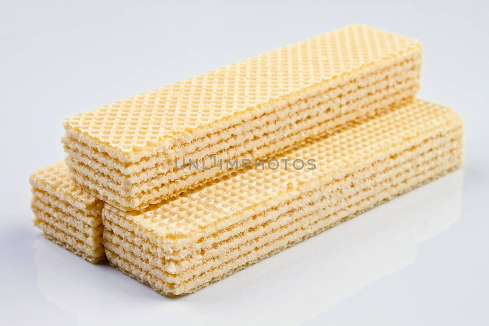 three wafers in a pile on white background