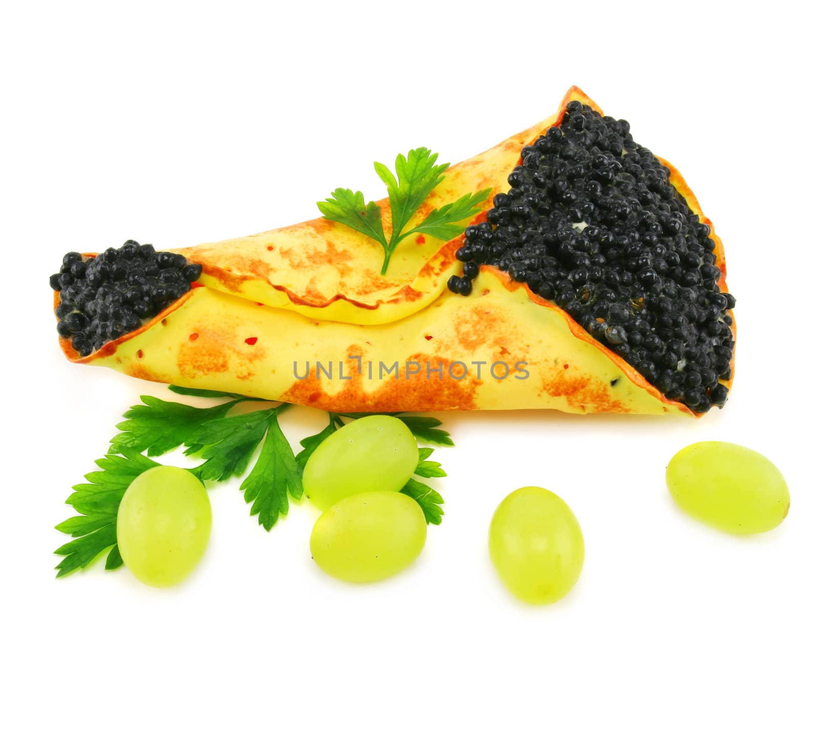 Caviar-stuffed pancake and grapes isolated on a white background