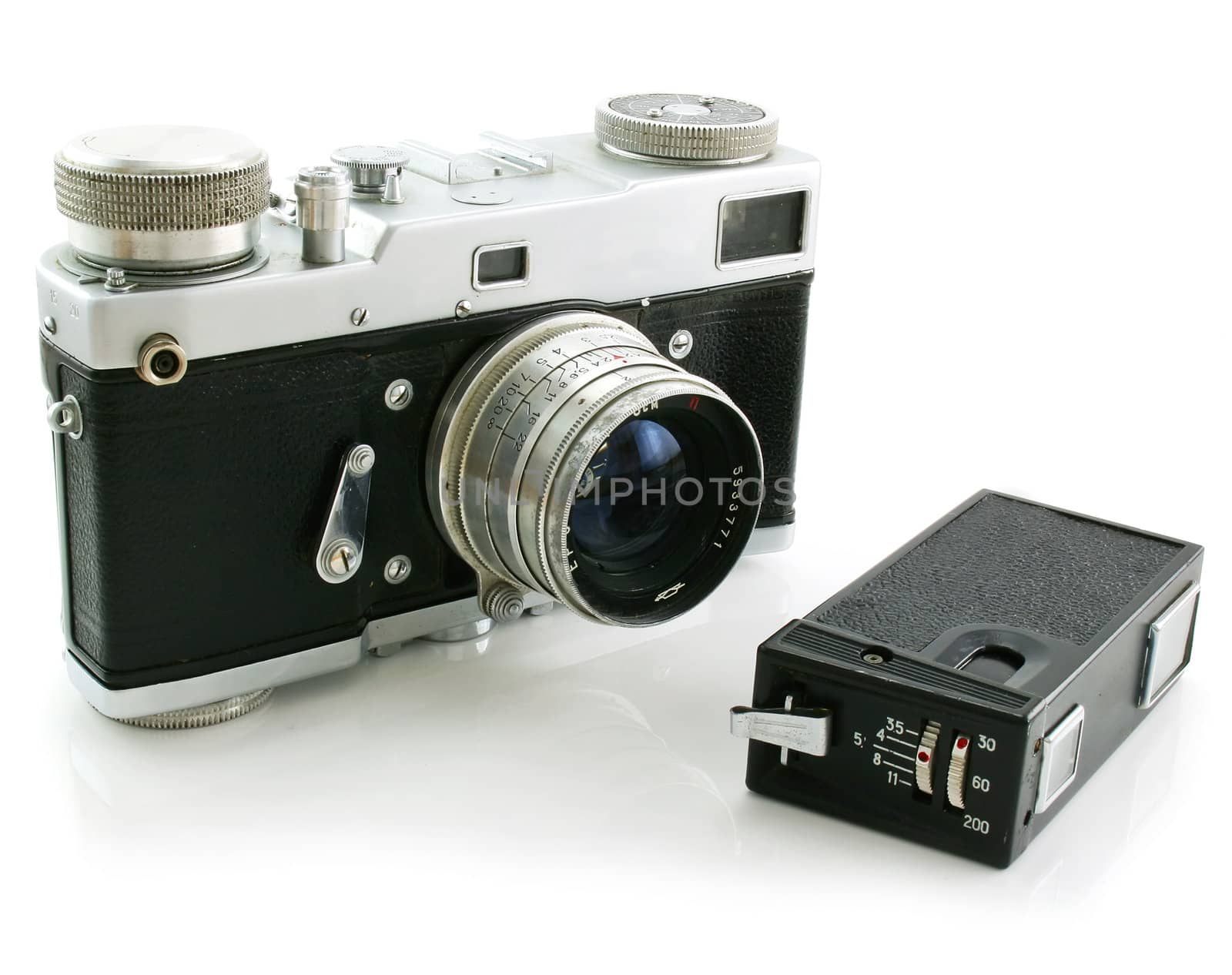 Small espionage photo camera and film camera isolated on a white background
