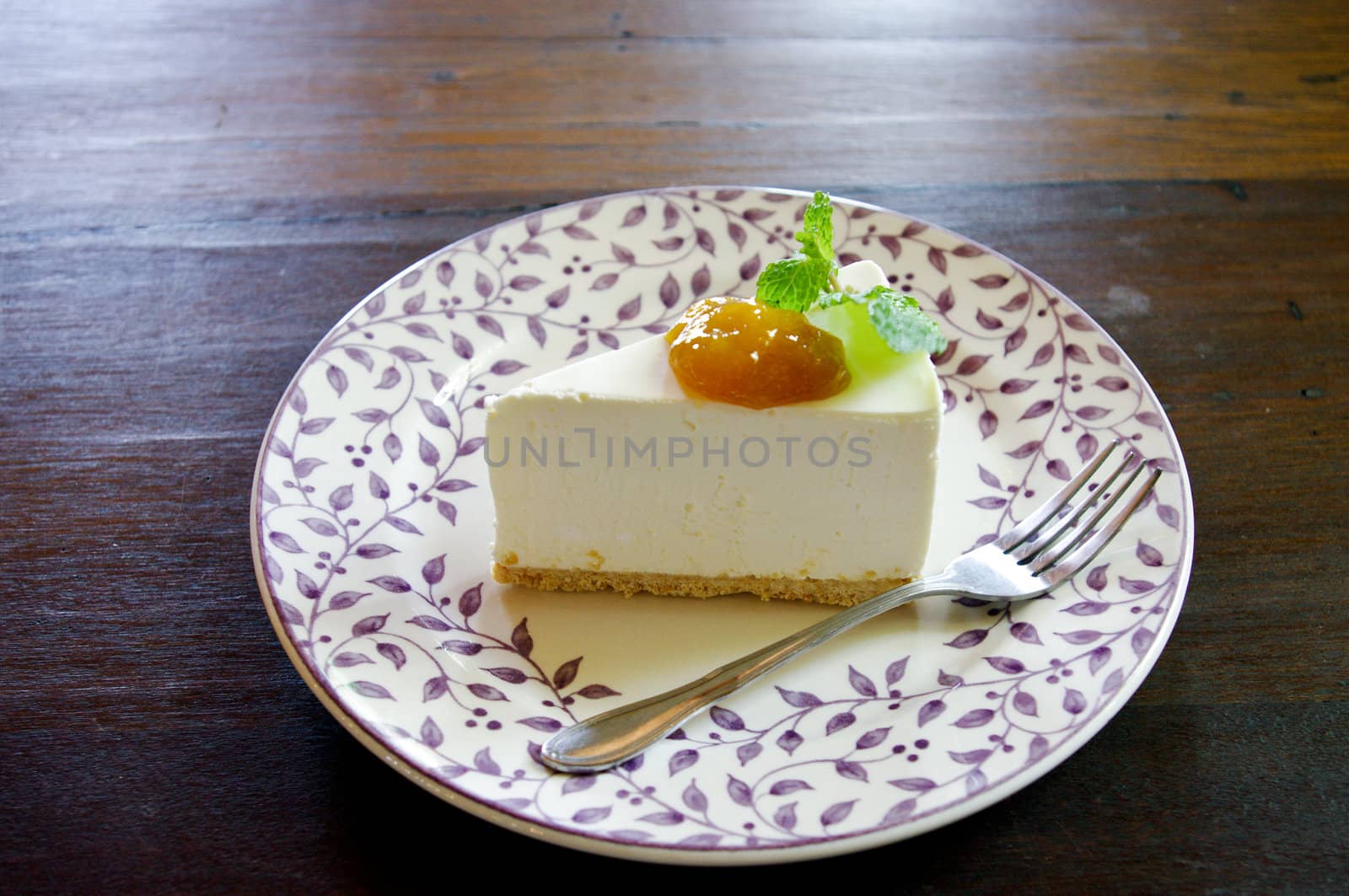 Cheesecake  with mango jam in Japanese style on wooden table