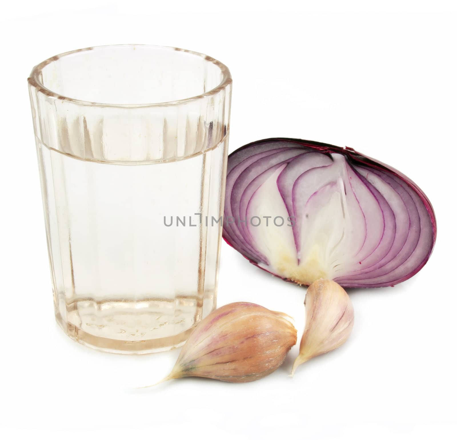 Glass of alcohol, garlic and onion by alphacell