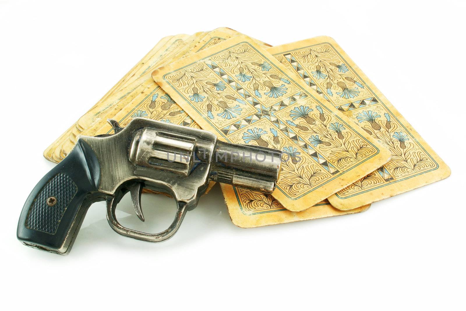 Gun and pack of cards isolated on a white background