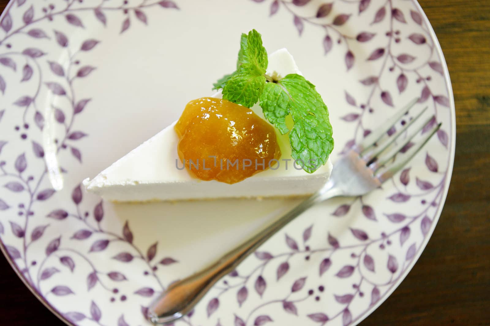 Cheesecake  with mango jam in Japanese style on wooden table