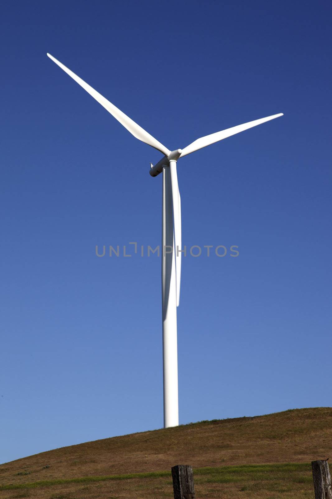 Wind turbine rotating through the air and generating power, WA., state.