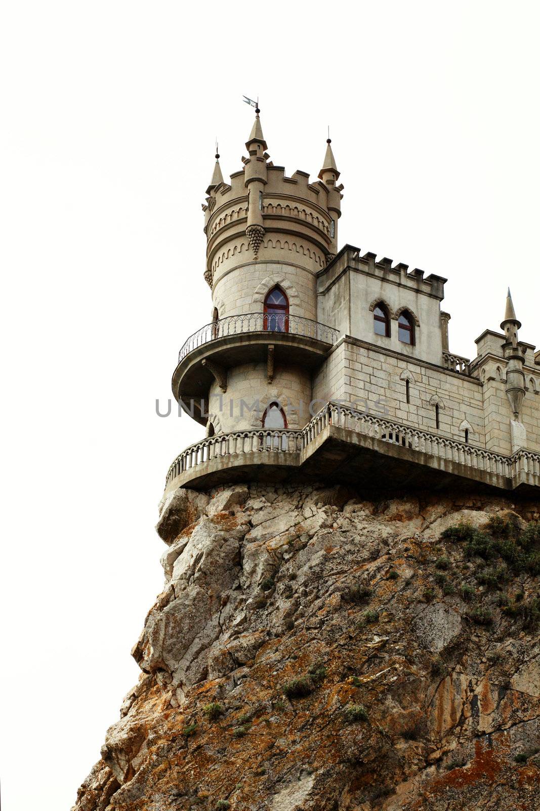 The castle in the Gothic style on cliff above the sea