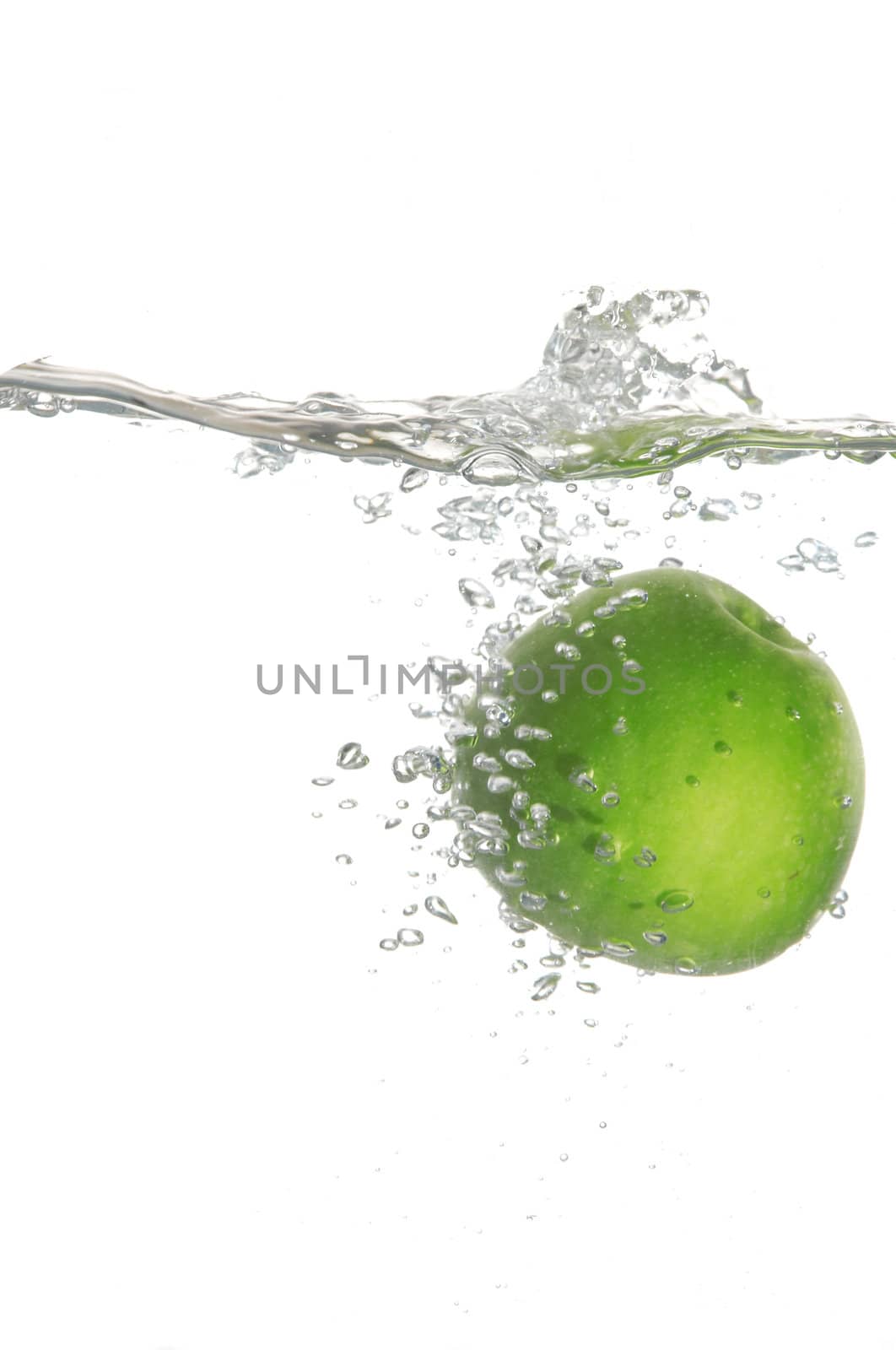 An image of green apple in water