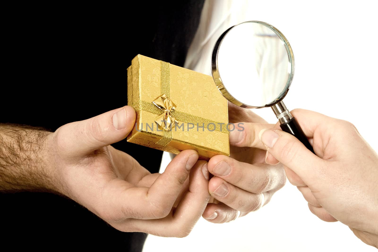 Stock photo: an image of a yellow box in hands of a man and magnifier