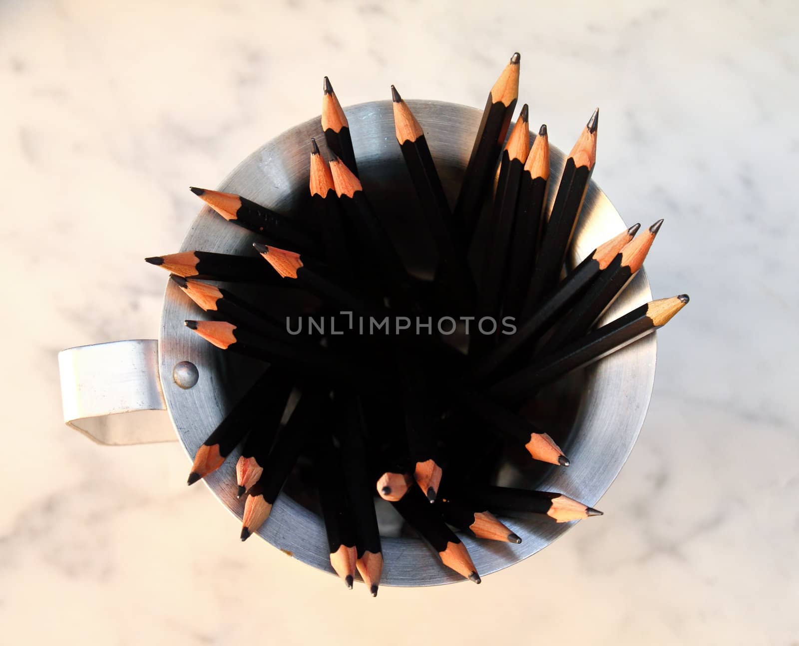 Bunch of pencils on cup by nuchylee