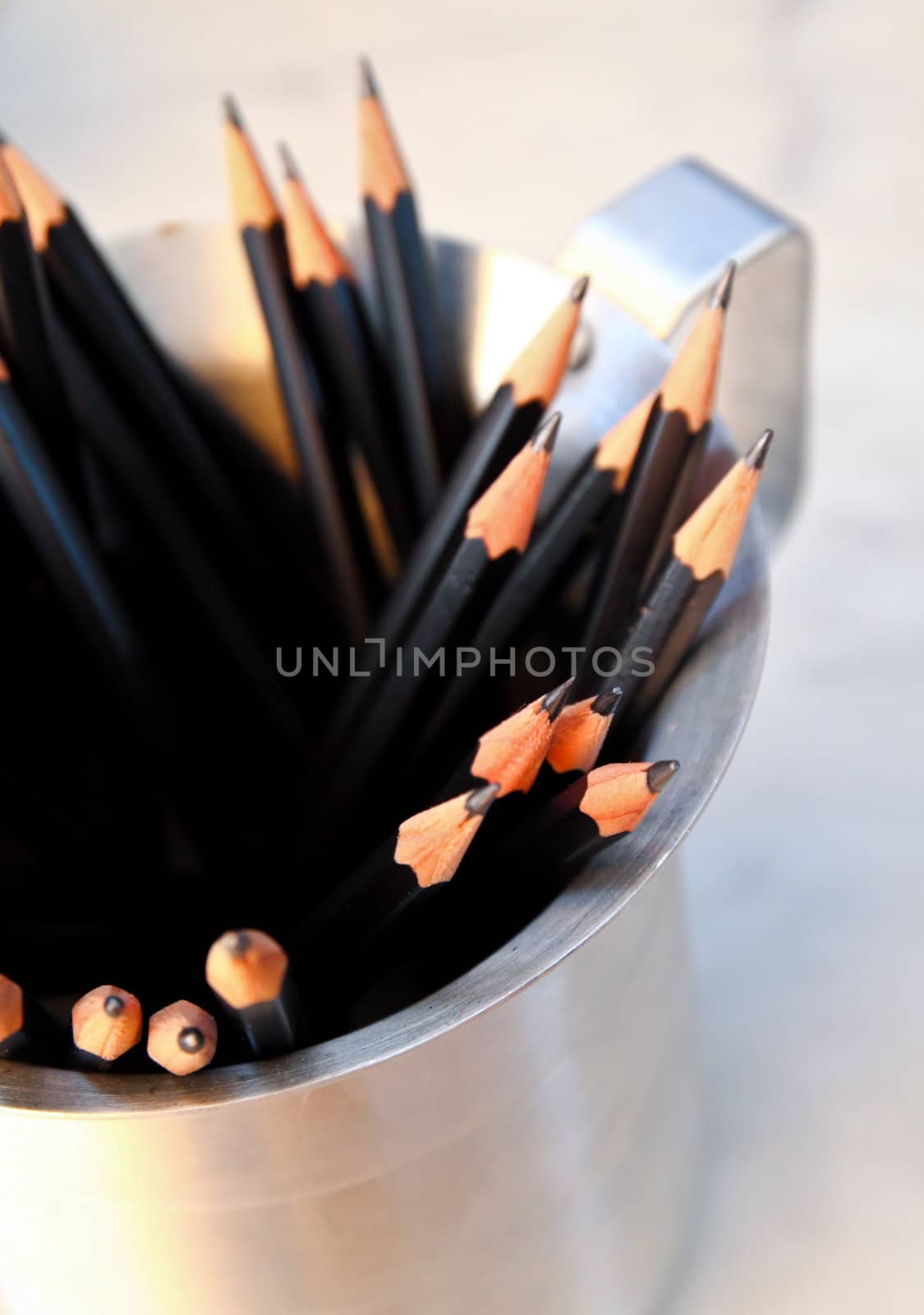 Bunch of pencils on cup by nuchylee