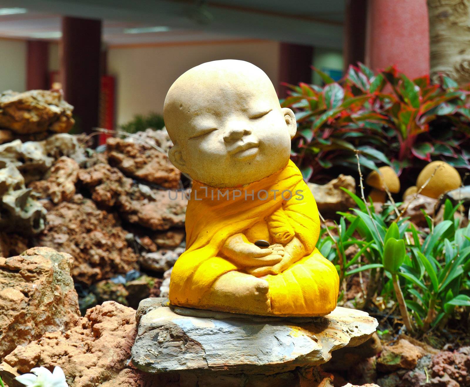 Doll clay monk used in ornamental garden in Thailand  by nuchylee