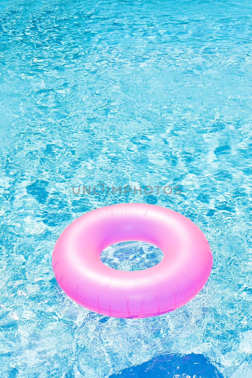 pink rubber ring in swimming pool