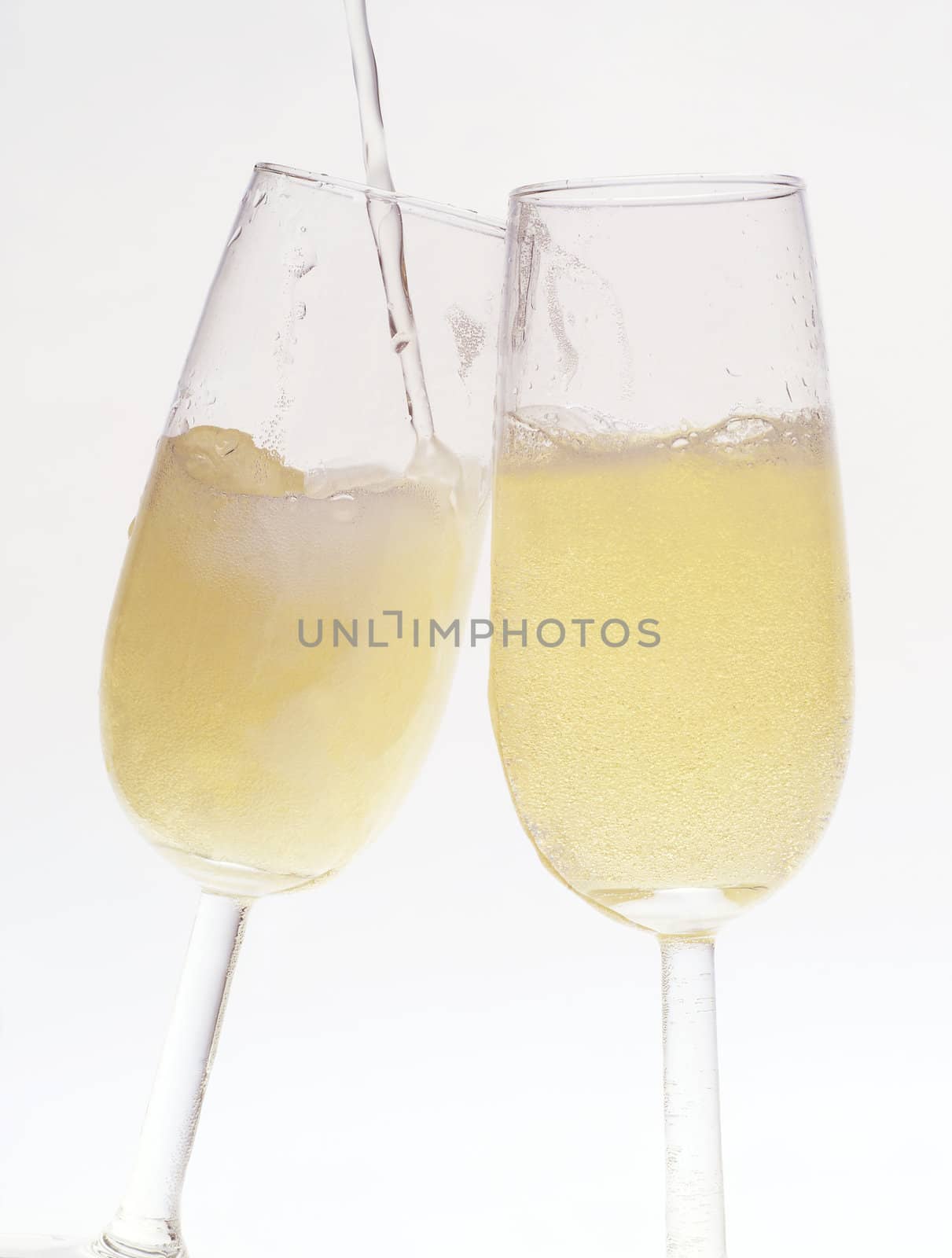 Two Glasses of champagne on white background