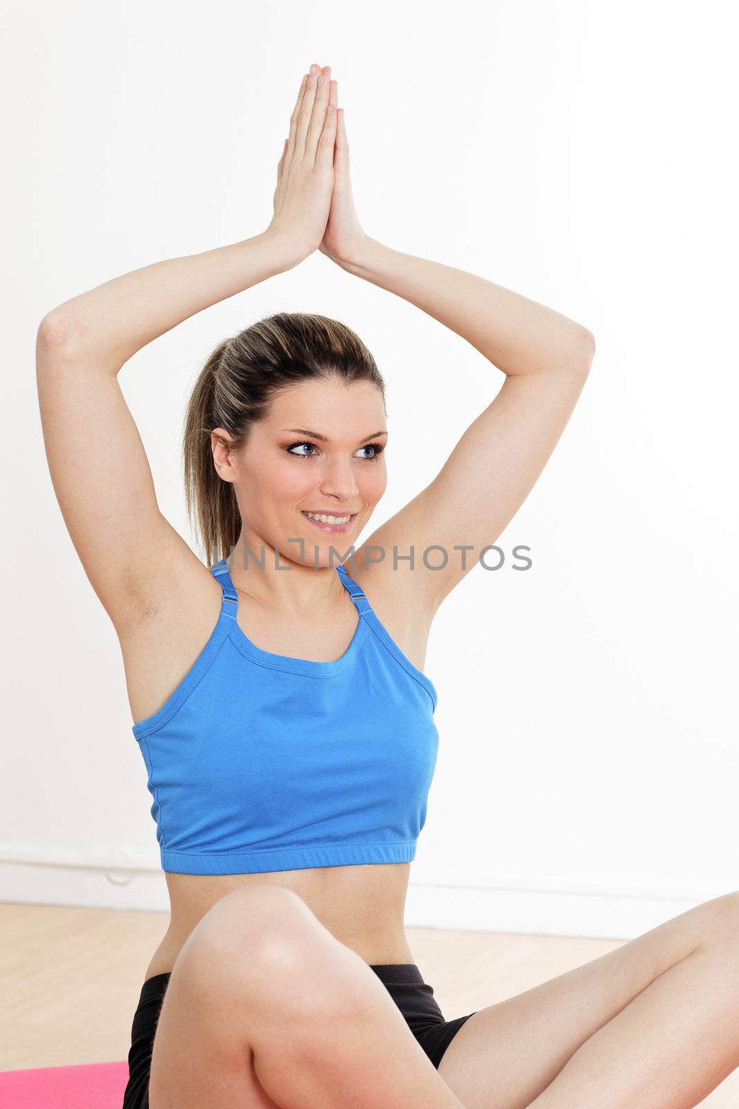 Portrait of twoman doing yoga exercise in sport gym 