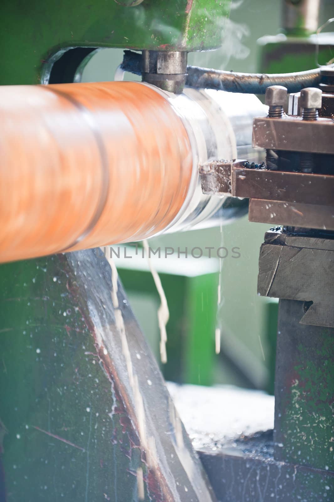 Lathe Turning Stainless Steel. Motion blur and shallow depth of field.