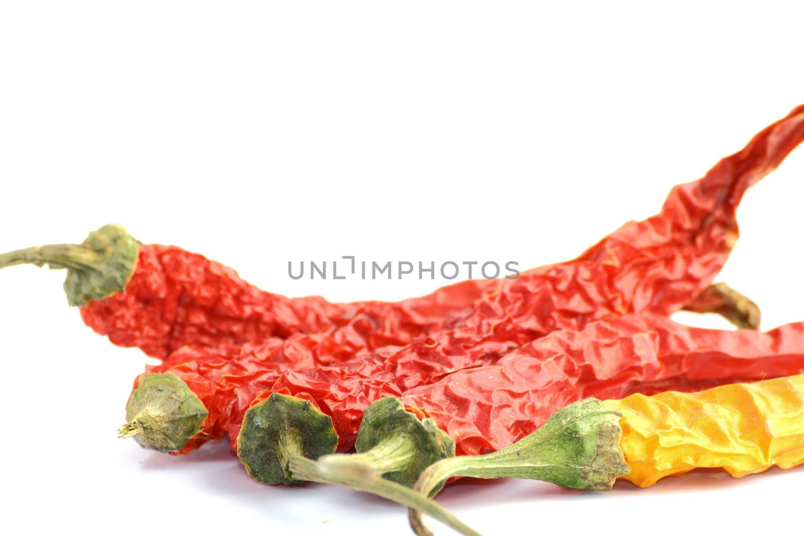 red peppers and a yellow one by taviphoto