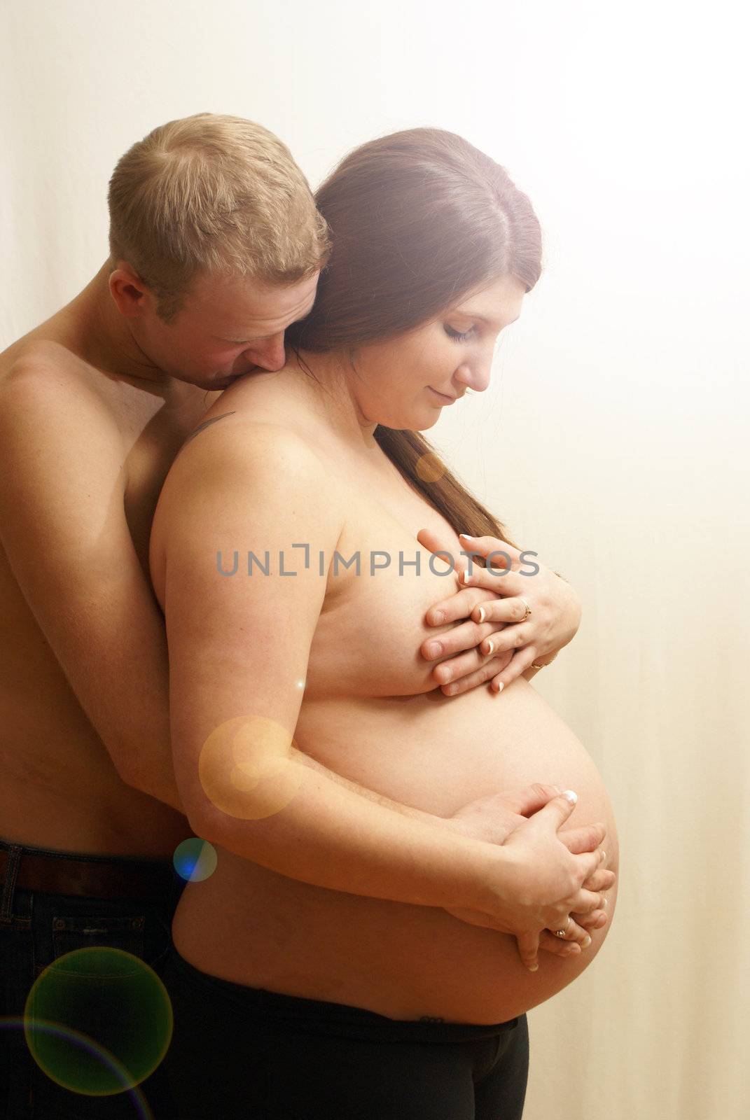 An intimate portrait of a couple who are having their first born child.