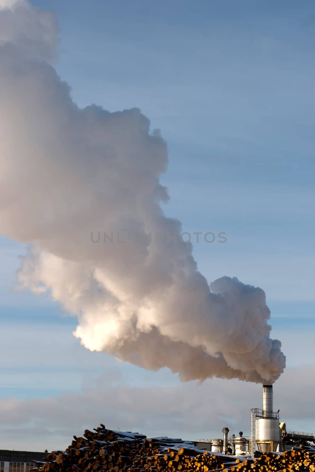 small factory chimney produce massive smoke in the air