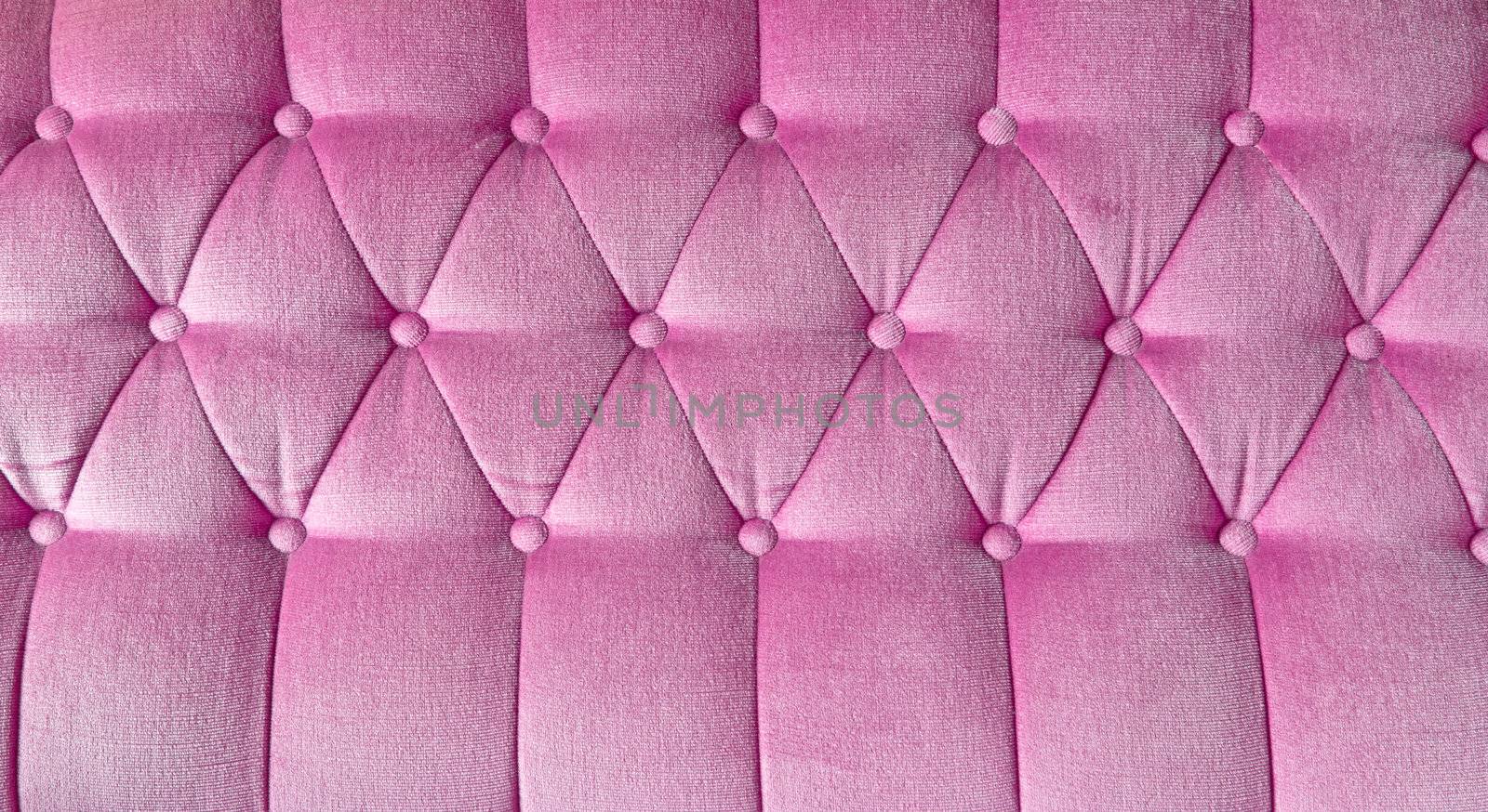 texture of pink fabric sofa for background by tungphoto