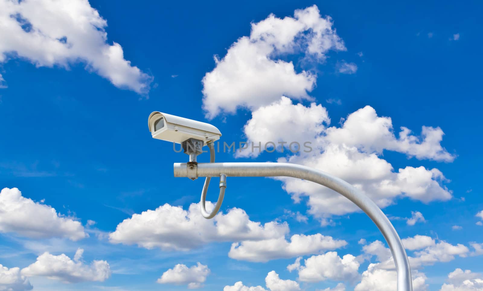 outdoor cctv camera against blue sky by tungphoto