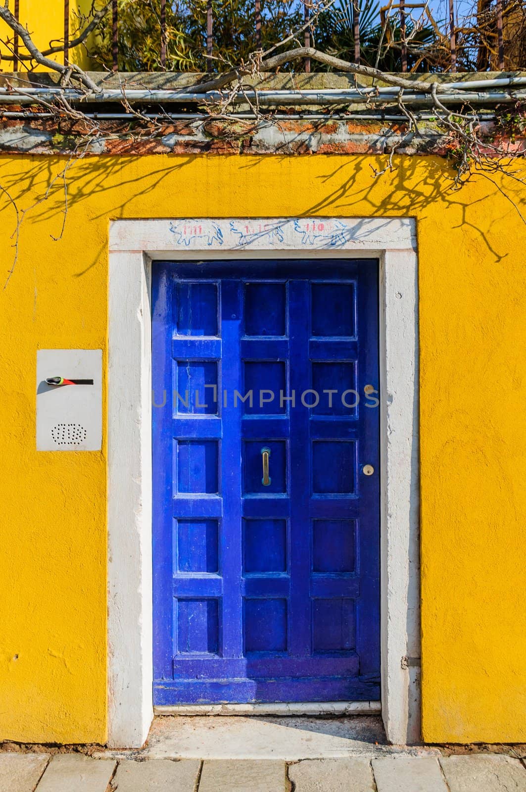 Door colorful houses of Burano, Venice, Italy