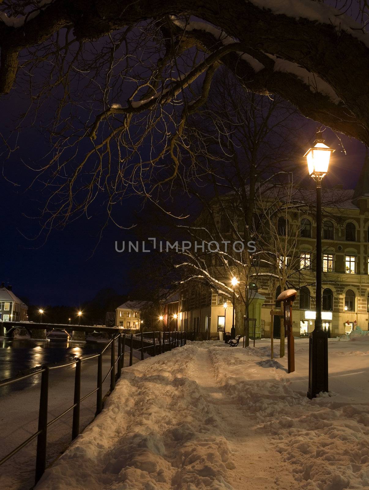 Illuminated street light at winter time