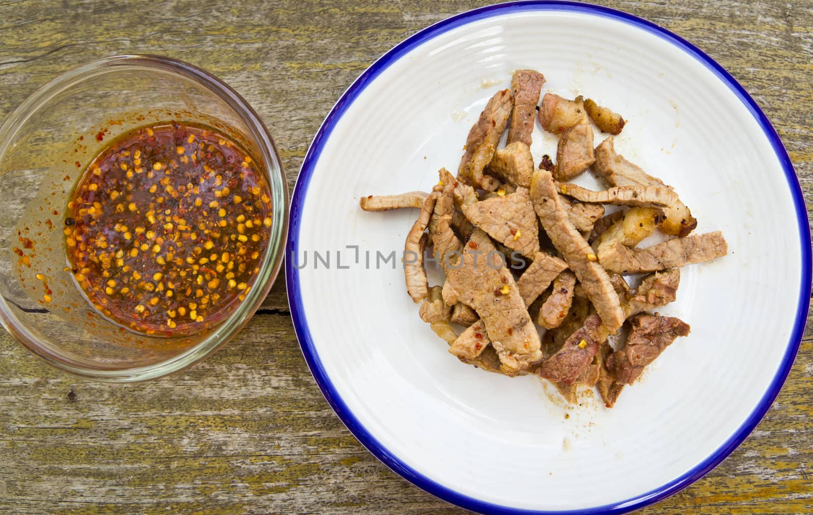 fired meat with chili sauce by tungphoto