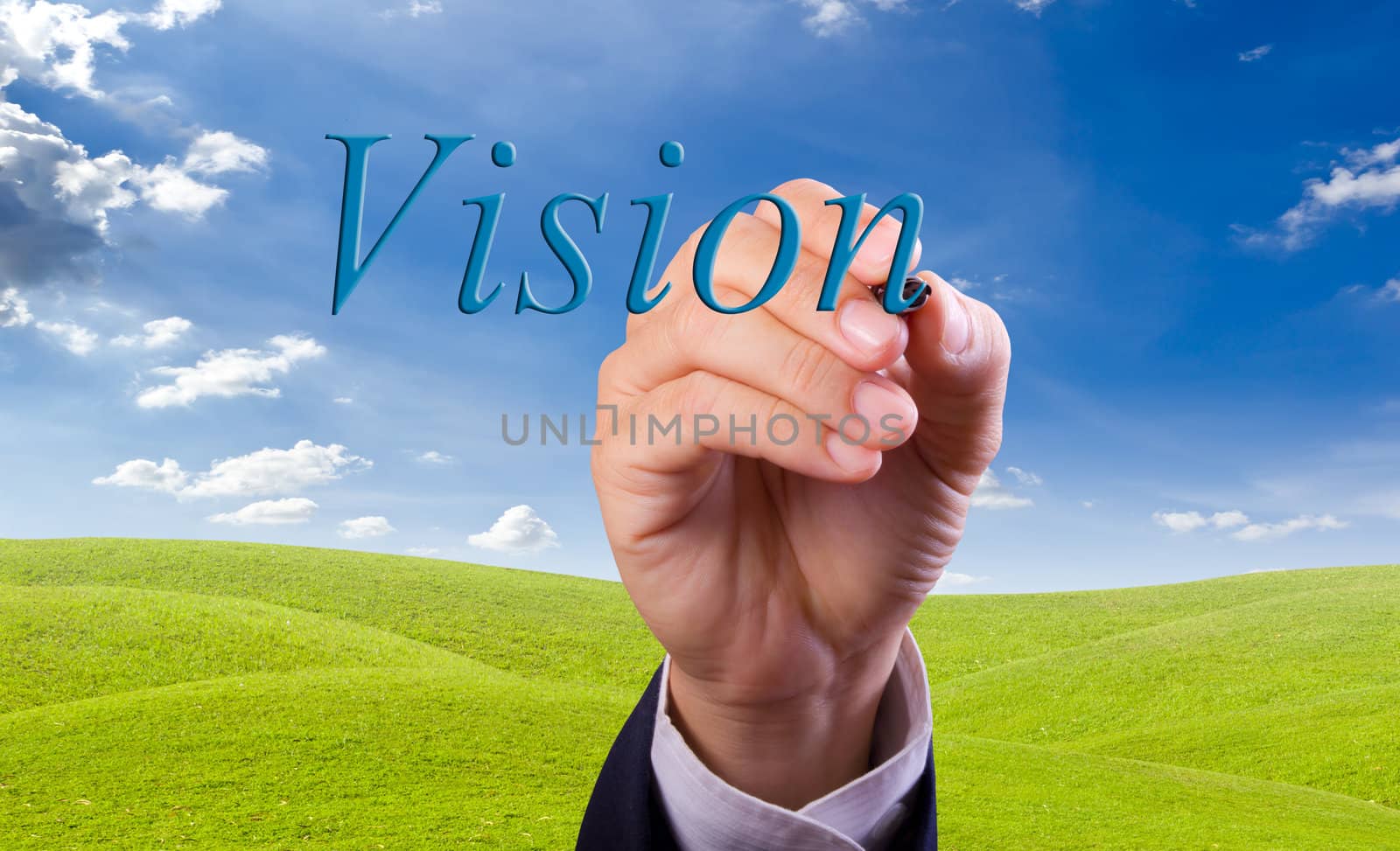 business man hand writing vision word by tungphoto