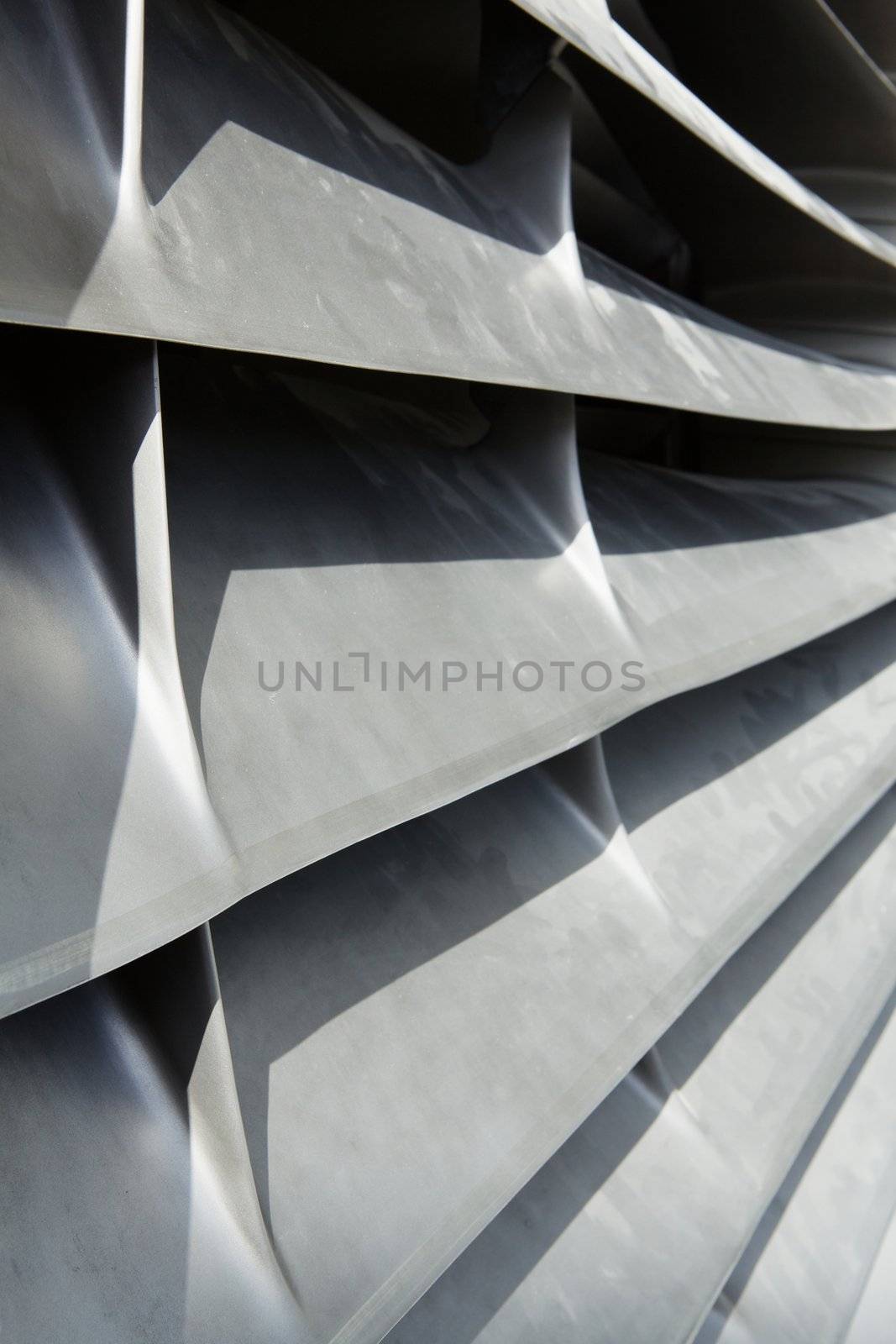 Close-up image of the inlet silvery metallic inlet vanes of an aircraft jet engine