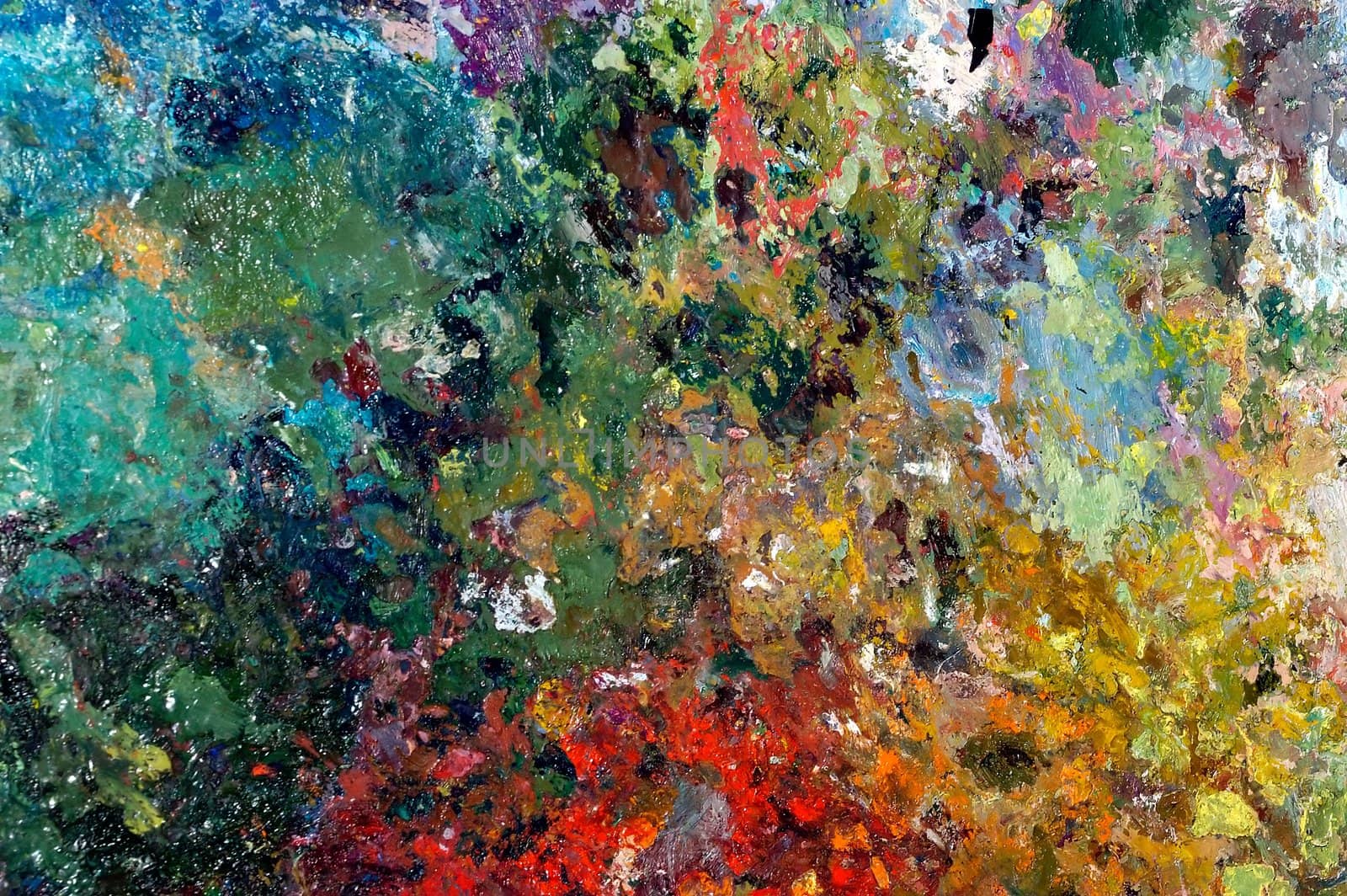An image with palette with oil paints
