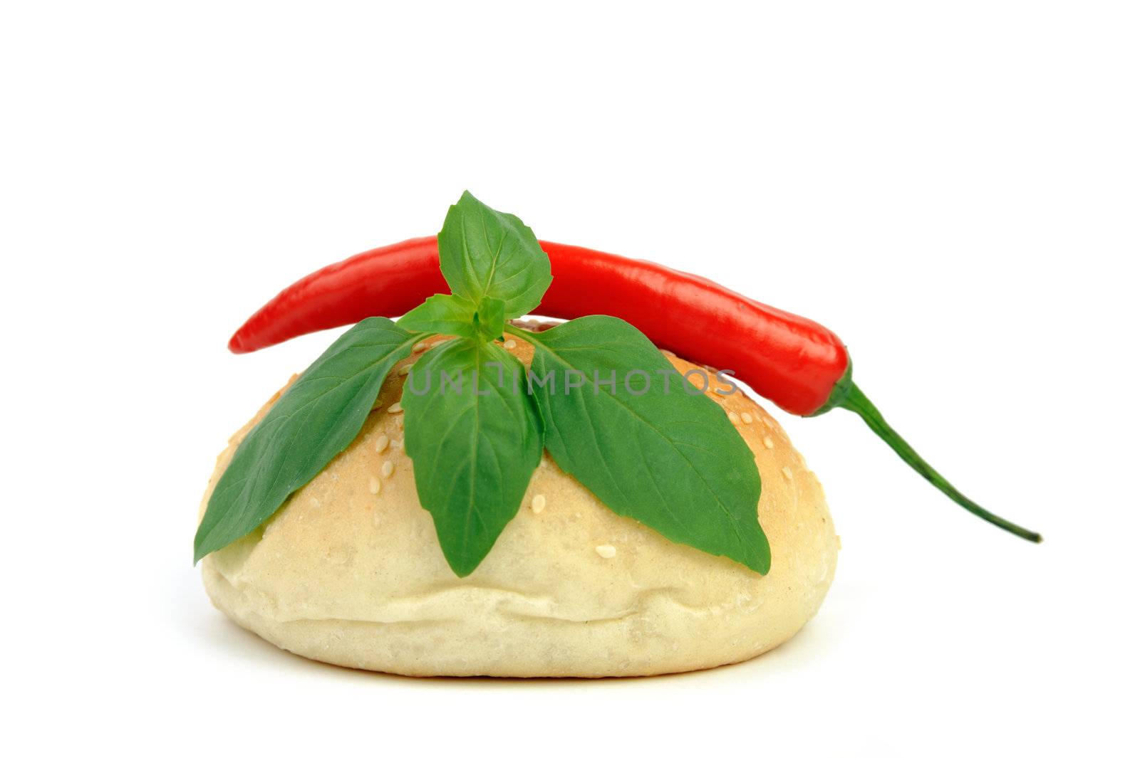 An image of a fresh bun, pepper and basil