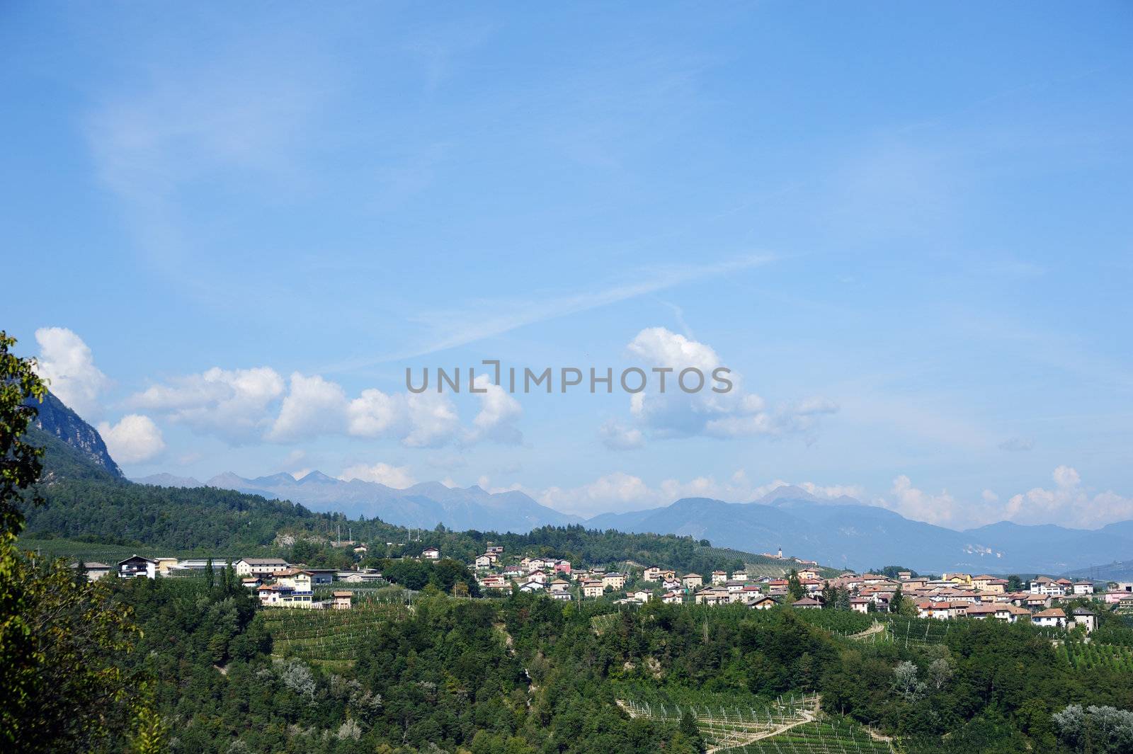 An image of a village in the mountains and blue sky