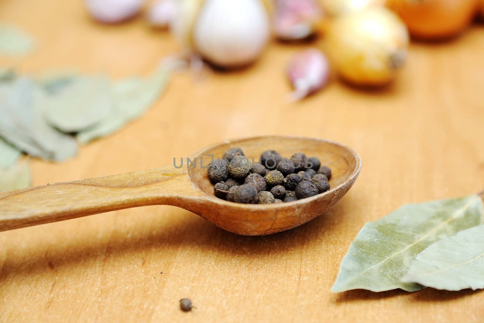 An image of spices on wooden table