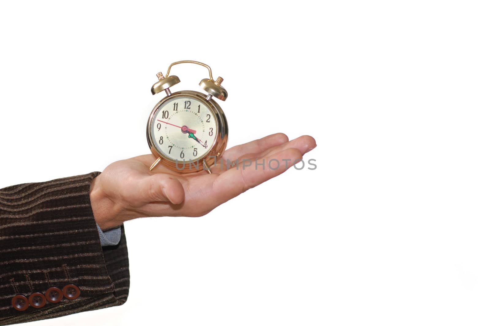 A man keeping an alarm clock in his palm