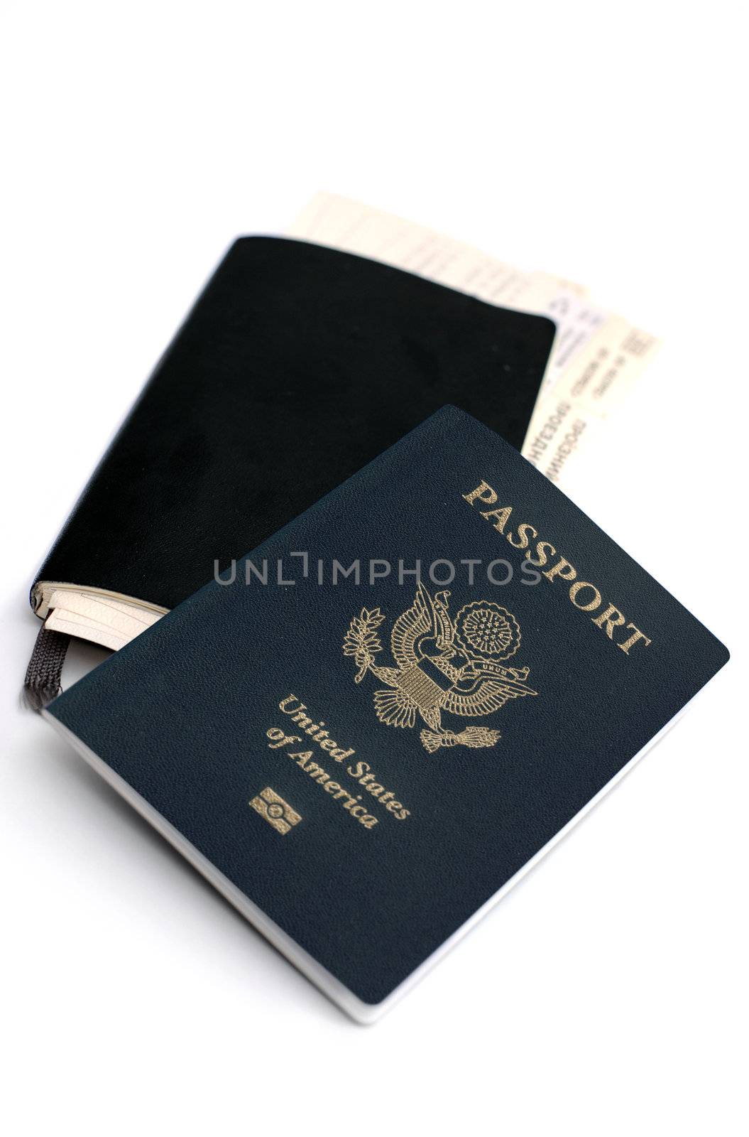 An image of a passport and a notebook on the table