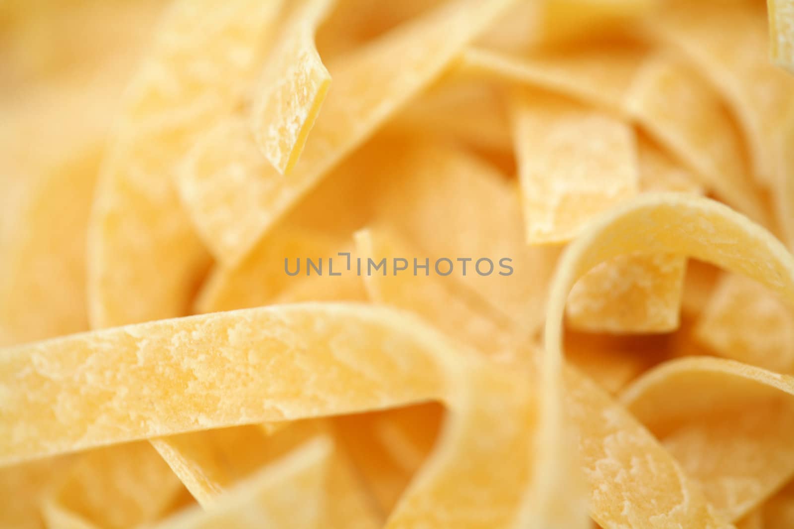 A background of yellow italic spaghetti close-up