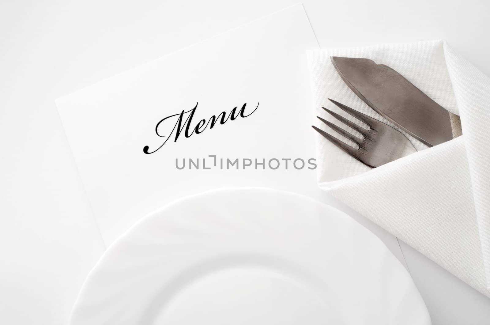 An image of a plate, knife and fork