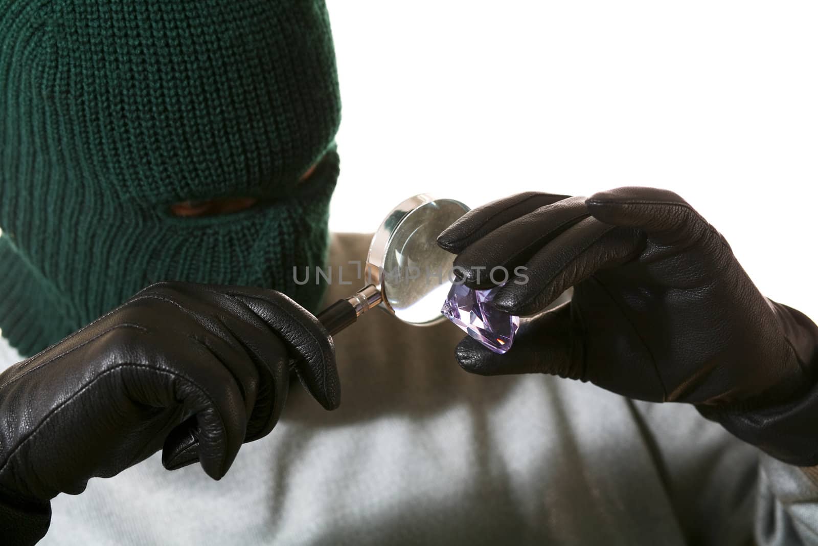 An image of a man in mask with lense and gem