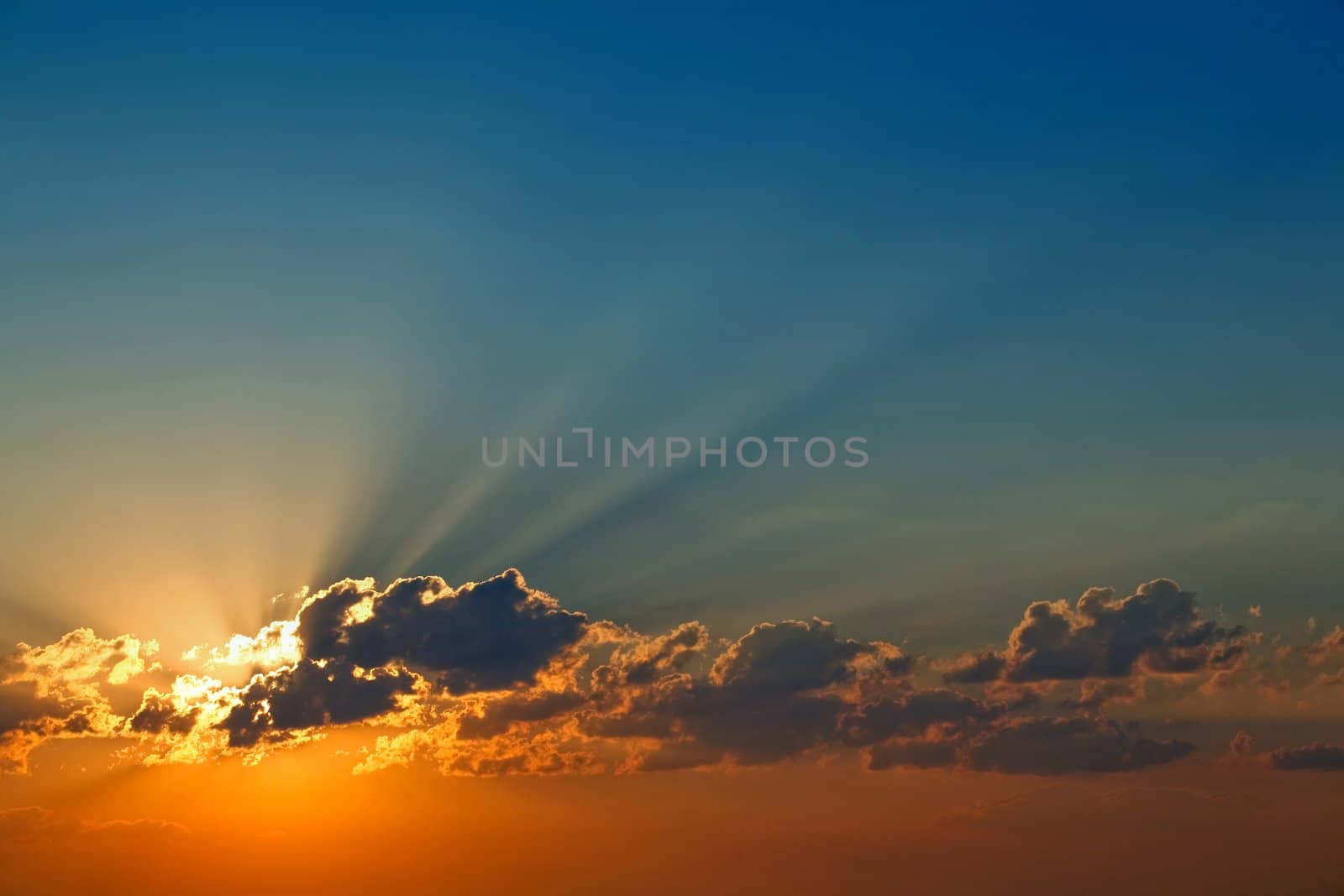 An image of plugging sun in a blue and orange sky