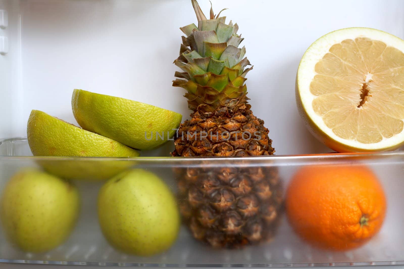 An image of fruits in a refrigerator