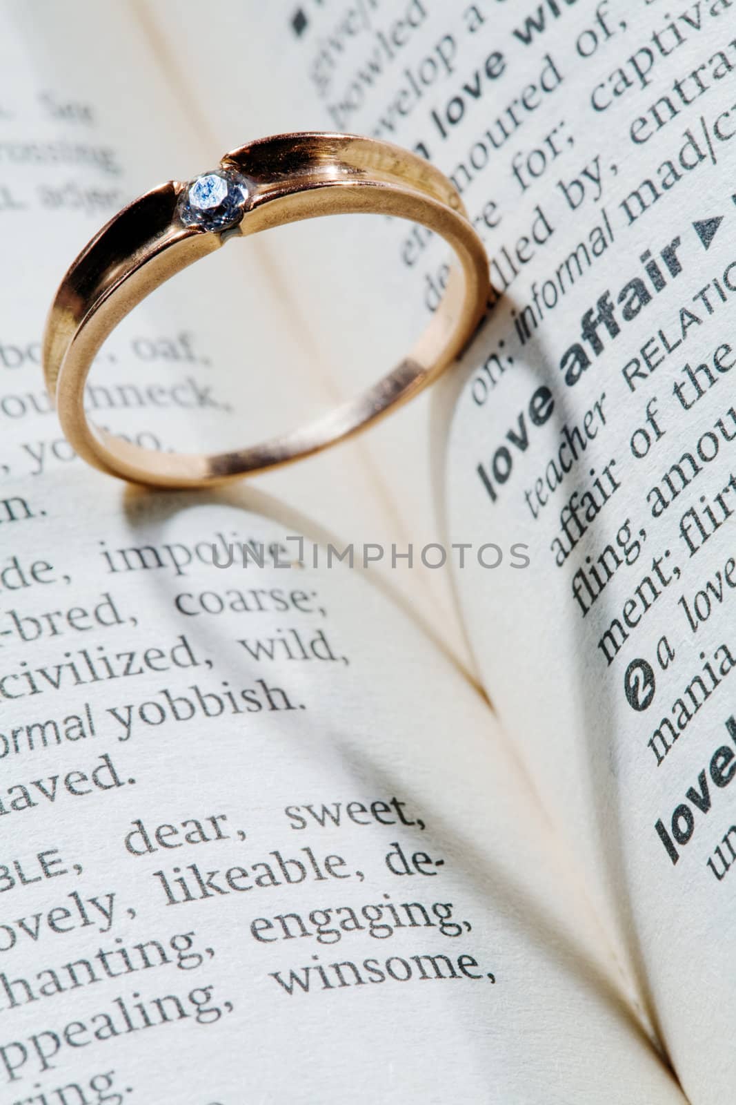 An image of a ring with shadow of a heart