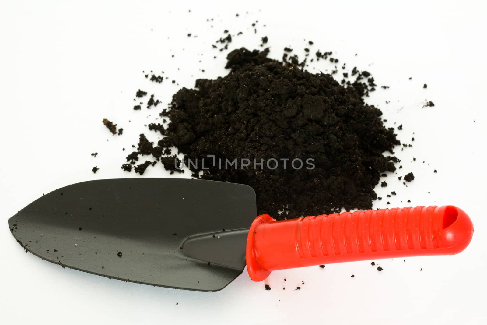 Stock photo: an image of a garden shovel and ground