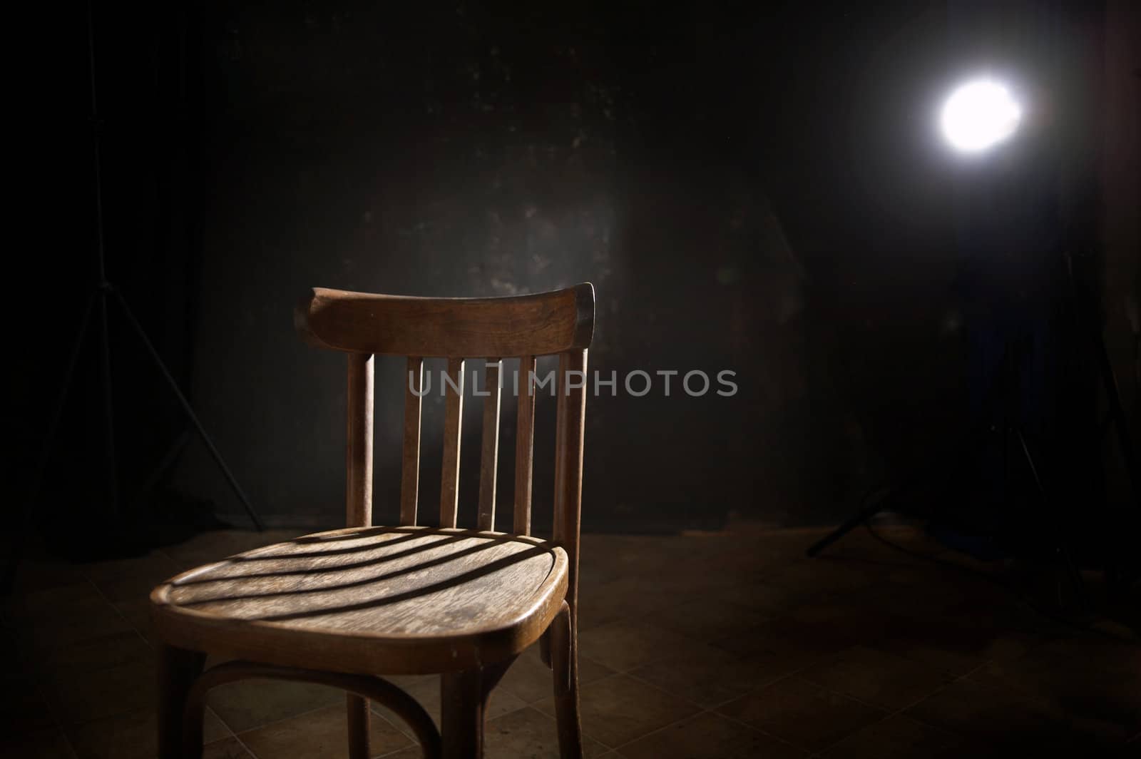 An image of chair in black room