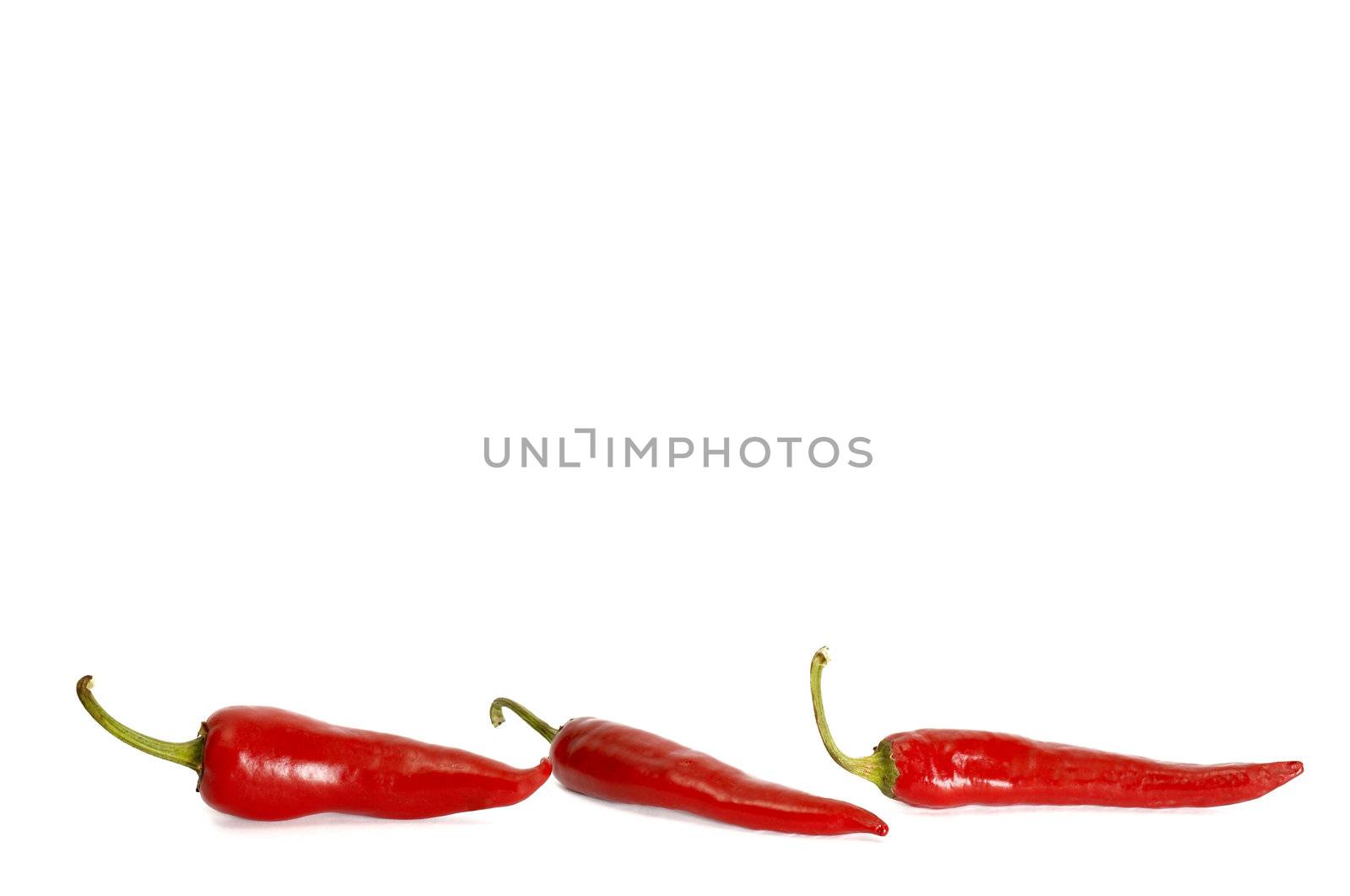 An image of three red peppers