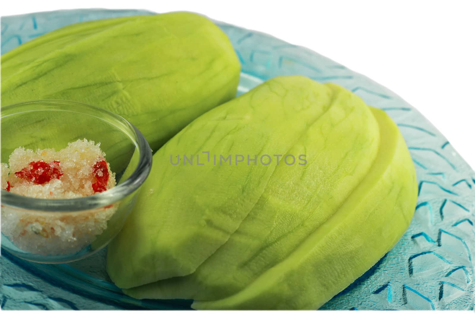 Sliced green mango on a white background by bajita111122