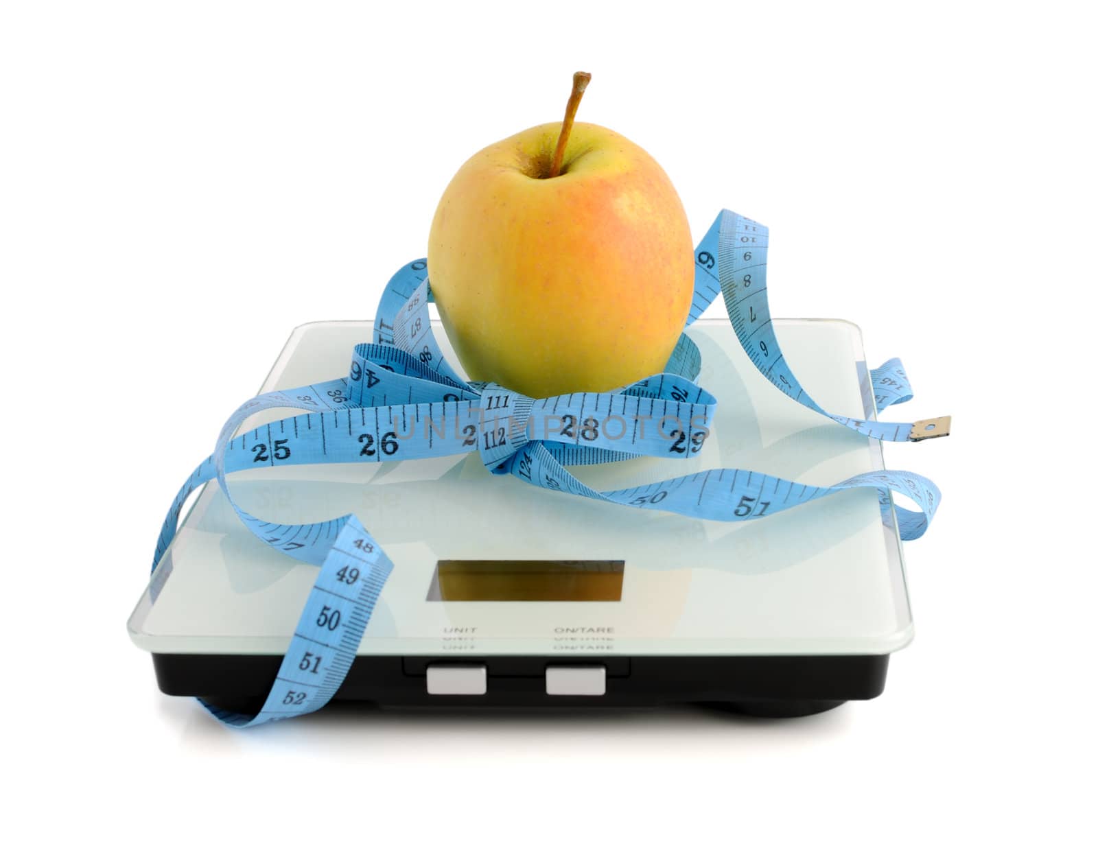 Apple on the scales measuring tape wrapped by Apolonia