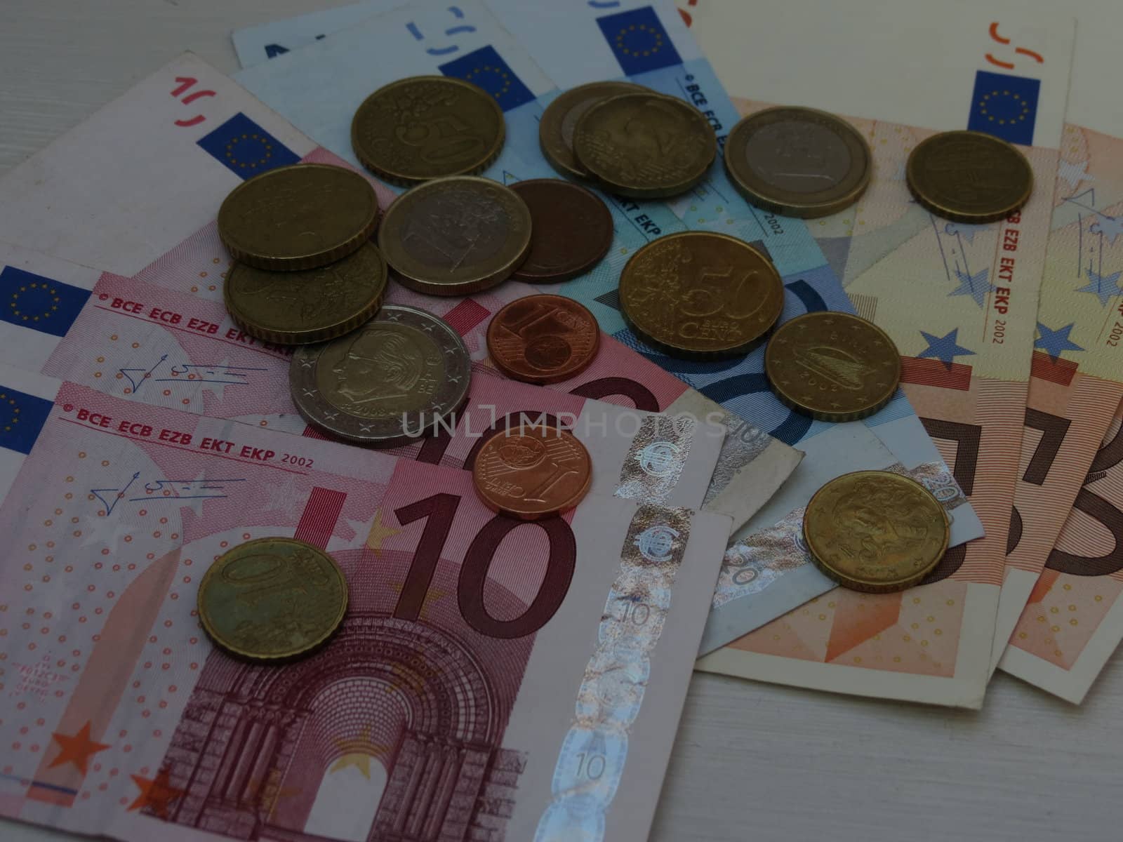 Euro (EUR) banknotes and coins money useful as a background or money concept